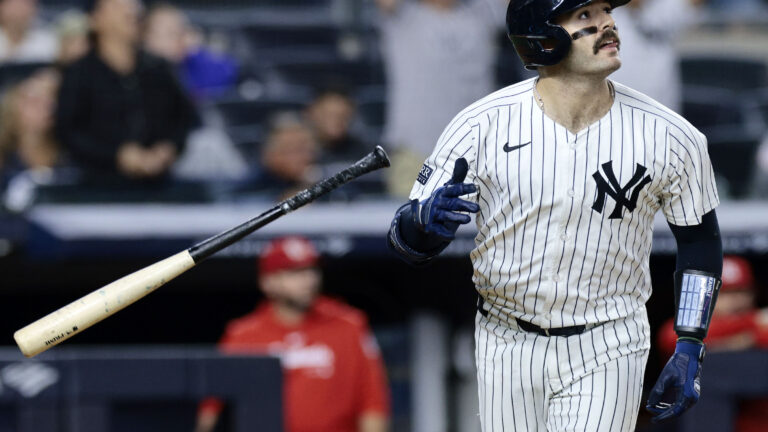 Austin Wells of the New York Yankees watches his two-run homerun in the bottom of the eighth inning during the game against the St. Louis Cardinals at Yankee Stadium.