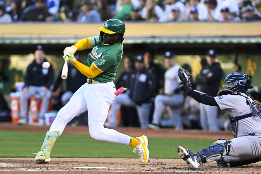 Oakland Athletics outfielder Lawrence Butler (4) hits a single during an MLB game between the New York Yankees and Oakland Athletics.