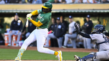 Oakland Athletics outfielder Lawrence Butler (4) hits a single during an MLB game between the New York Yankees and Oakland Athletics.