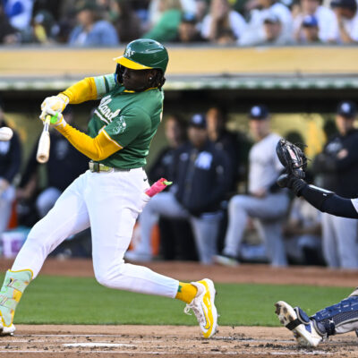 Oakland Athletics outfielder Lawrence Butler (4) hits a single during an MLB game between the New York Yankees and Oakland Athletics.