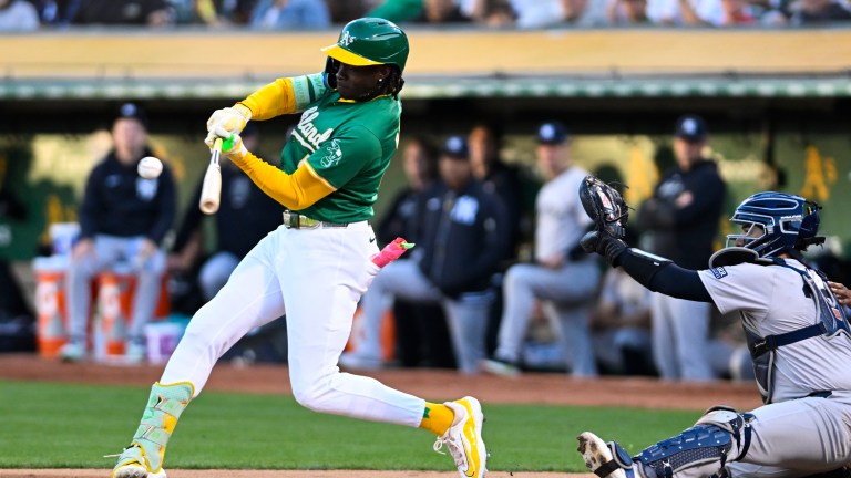 Oakland Athletics outfielder Lawrence Butler (4) hits a single during an MLB game between the New York Yankees and Oakland Athletics.