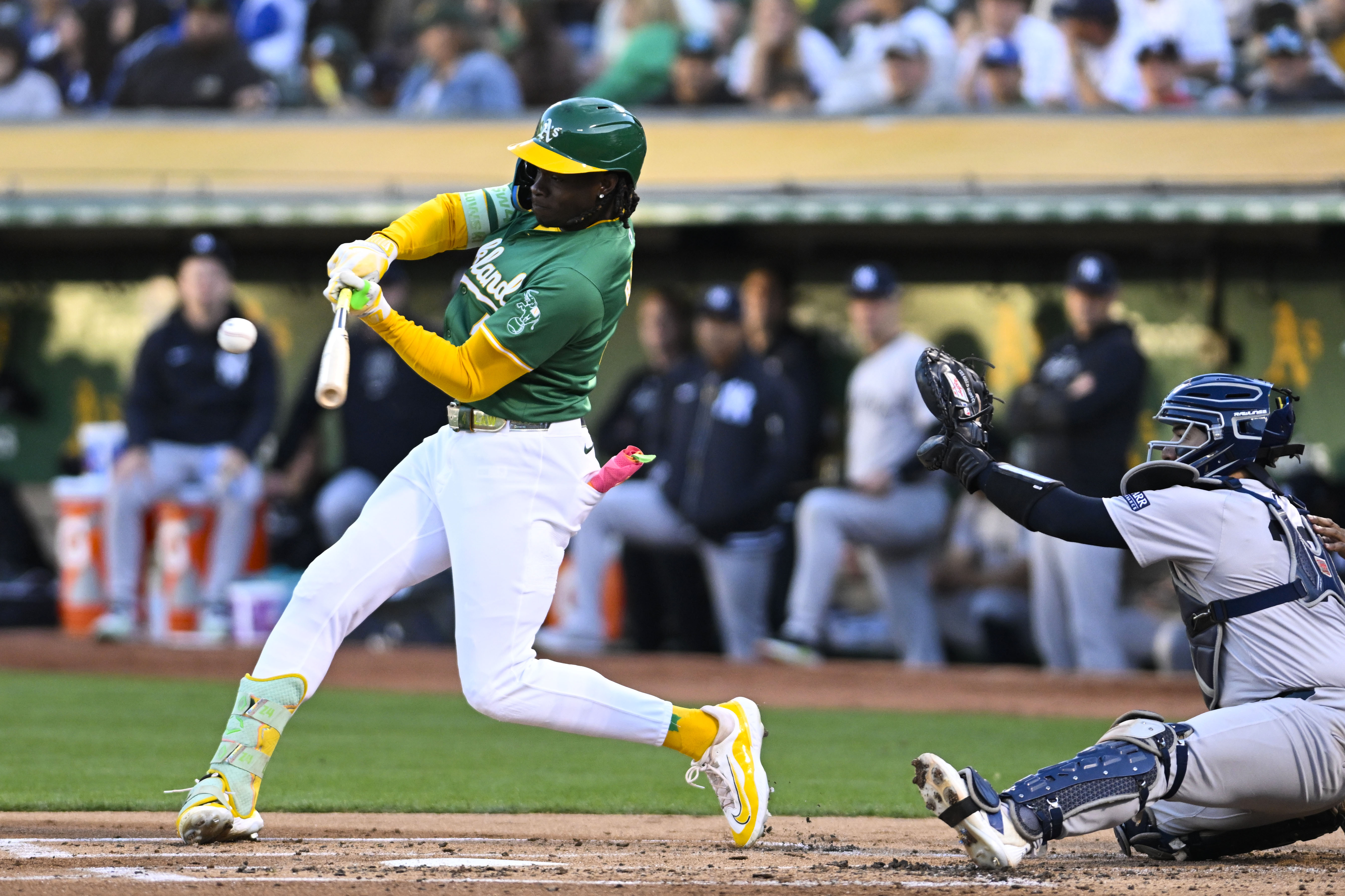 Oakland Athletics outfielder Lawrence Butler (4) hits a single during an MLB game between the New York Yankees and Oakland Athletics.