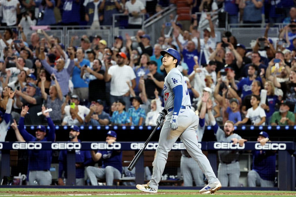 Shohei Ohtani of the Los Angeles Dodgers hits a three-run home run in the seventh inning to become the first player in Major League Baseball history to reach 50 Home Runs and 50 Stolen bases in a single season during the game between the Los Angeles Dodgers and the Miami Marlins at loanDepot park.