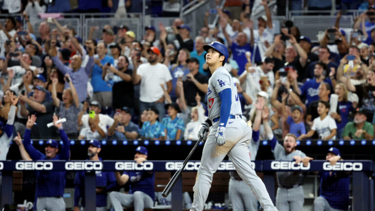 Shohei Ohtani of the Los Angeles Dodgers hits a three-run home run in the seventh inning to become the first player in Major League Baseball history to reach 50 Home Runs and 50 Stolen bases in a single season during the game between the Los Angeles Dodgers and the Miami Marlins at loanDepot park.
