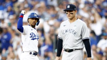 Mookie Betts #50 of the Los Angeles Dodgers after a single against the New York Yankees in the first inning at Dodger Stadium.
