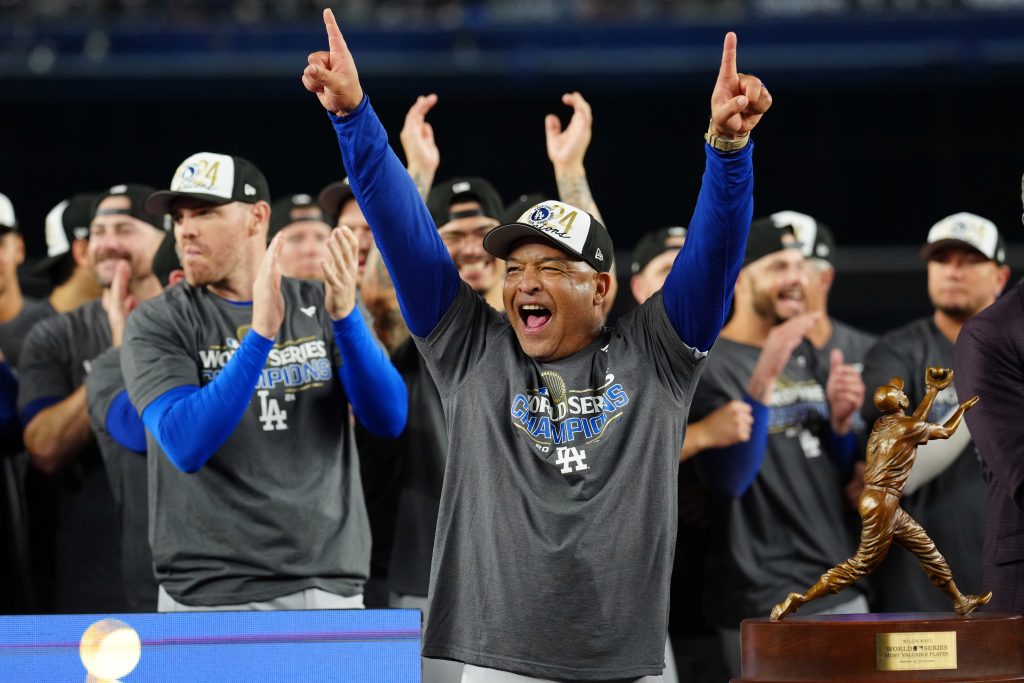 Manager Dave Roberts #30 of the Los Angeles Dodgers celebrates after the Dodgers defeated the New York Yankees in Game 5 to clinch the 2024 World Series presented by Capital One at Yankee Stadium.