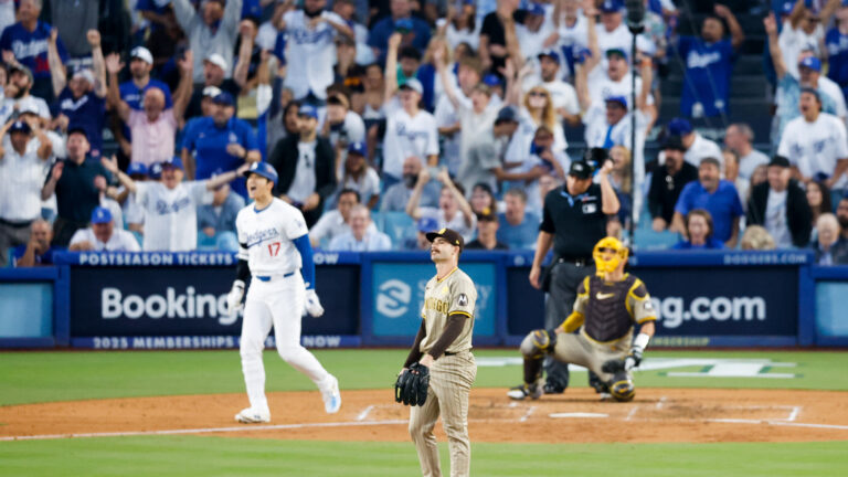 Dylan Cease #84 of the San Diego Padres watches a three-run home run by Shohei Ohtani #17 of the Los Angeles Dodgers during the second inning game one of the National League Division Series at Dodger Stadium.