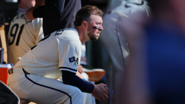 MINNEAPOLIS, MN - SEPTEMBER 29: Kyle Farmer #12 of the Minnesota Twins looks on in the dugout in the eighth inning against the Baltimore Orioles at Target Field on September 29, 2024 in Minneapolis, Minnesota. The Baltimore Orioles defeated the Minnesota Twins 6-2.(Photo by Adam Bettcher/Getty Images)