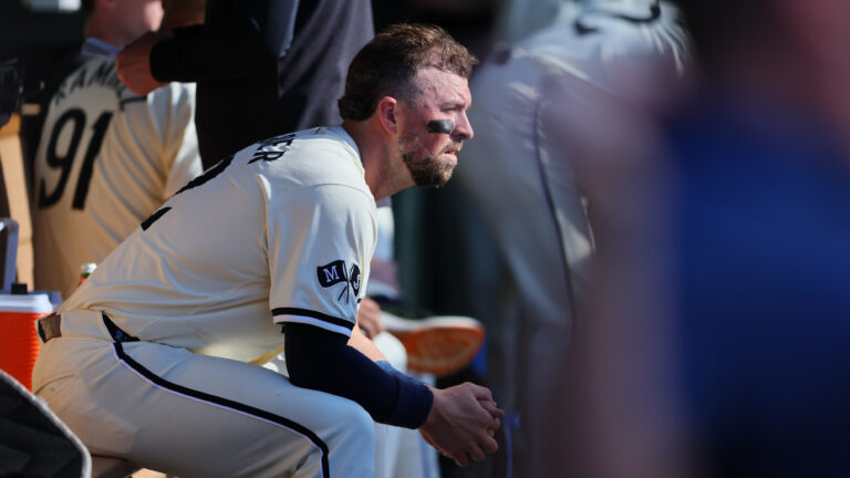 MINNEAPOLIS, MN - SEPTEMBER 29: Kyle Farmer #12 of the Minnesota Twins looks on in the dugout in the eighth inning against the Baltimore Orioles at Target Field on September 29, 2024 in Minneapolis, Minnesota. The Baltimore Orioles defeated the Minnesota Twins 6-2.(Photo by Adam Bettcher/Getty Images)