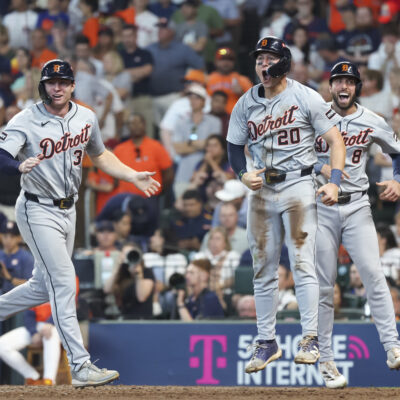 HOUSTON, TX - OCTOBER 02: (left to right) Detroit Tigers second baseman Colt Keith (33), Detroit Tigers first baseman Spencer Torkelson (20) and Detroit Tigers right fielder Matt Vierling (8) cheer on Detroit Tigers third baseman Andy Ibáñez (77) (not pictured), cheer he gets on third base in the top of the eighth inning during the 2024 AL Wild Card Game between the Detroit Tigers and Houston Astros on October 2, 2024 at Minute Maid Park in Houston, Texas. (Photo by Leslie Plaza Johnson/Icon Sportswire via Getty Images)