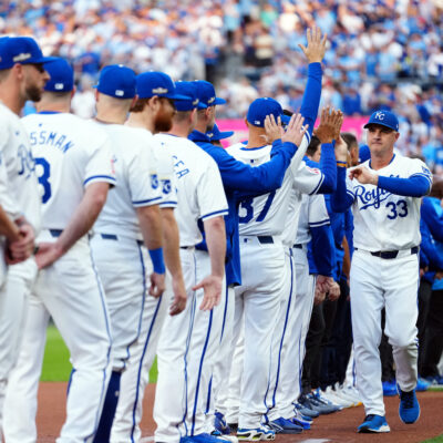 KANSAS CITY, MO - OCTOBER 09: Manager Matt Quatraro #33 of the Kansas City Royals is greeted by players during the pre-game ceremony prior to Game 3 of the Division Series presented by Booking.com between the New York Yankees and the Kansas City Royals at Kauffman Stadium on Wednesday, October 9, 2024 in Kansas City, Missouri. (Photo by Mary DeCicco/MLB Photos via Getty Images)