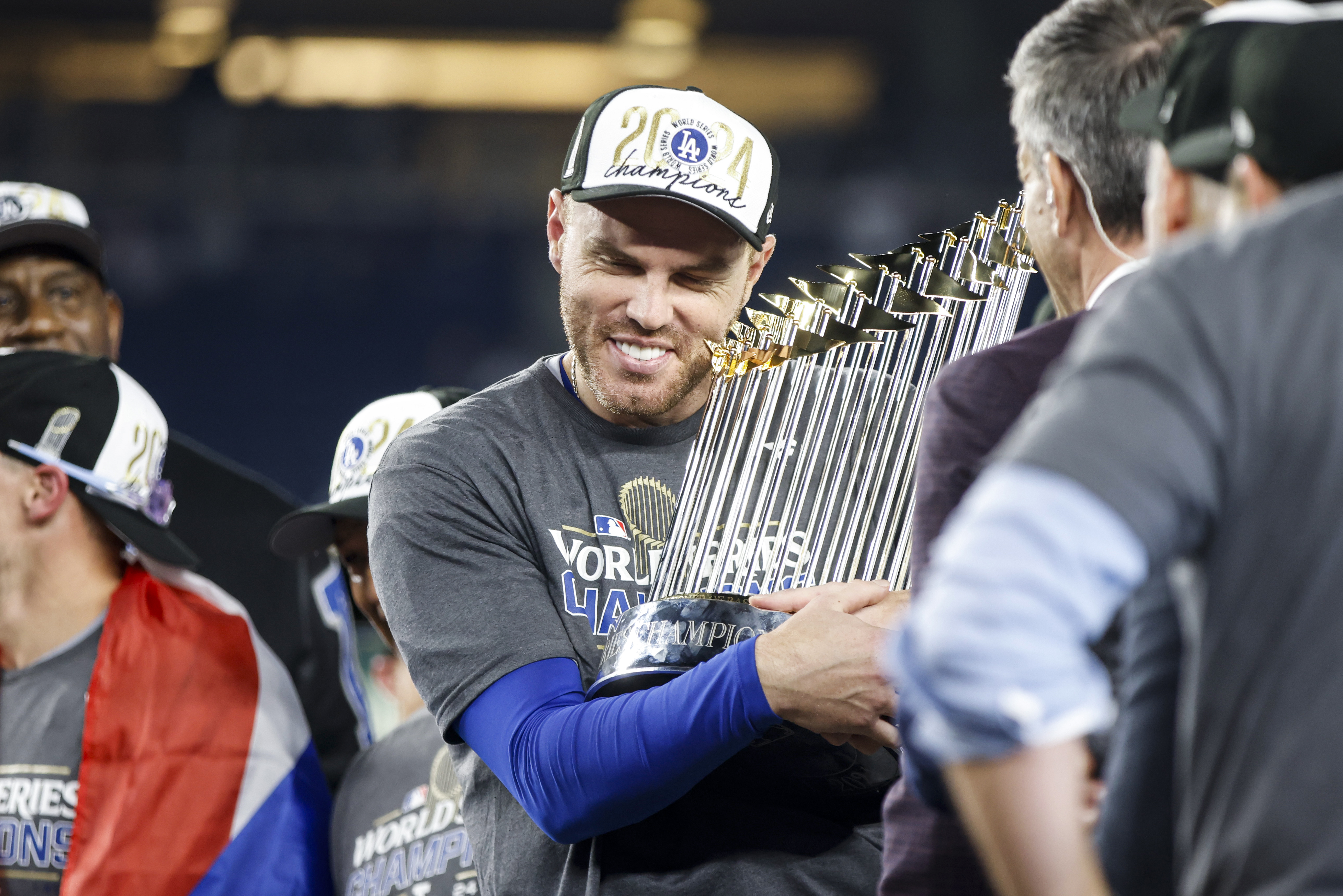 NEW YORK, NY - OCTOBER 30: Freddie Freeman #5 of the Los Angeles Dodgers celebrates with the Commissioner's Trophy after winning Game 5 of the 2024 World Series presented by Capital One between the Los Angeles Dodgers and the New York Yankees at Yankee Stadium on Wednesday, October 30, 2024 in New York, New York. The Los Angeles Dodgers won 7-6. (Photo by Rob Tringali/MLB Photos via Getty Images)