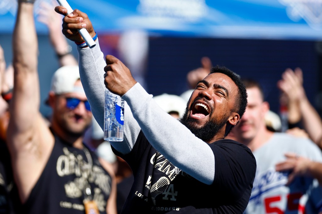 Free agent Teoscar Hernandez (then of the Los Angeles Dodgers) celebrates during the 2024 World Series Celebration Show at Dodger Stadium.
