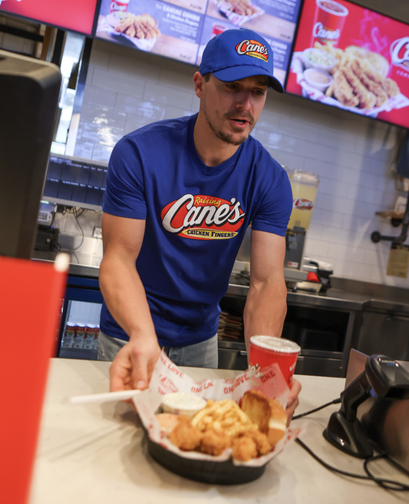 Home Plate Meets Front Counter! Kike Hernández Serves Fans Box Combos During Celebratory World Series “Shift” at Raising Cane’s in Los Angeles.