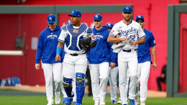 KANSAS CITY, MISSOURI - MAY 4: Michael Wacha #52 of the Kansas City Royals walks in from the bullpen with Salvador Perez #13 (2L) prior to a game against the Texas Rangers at Kauffman Stadium on May 4, 2024 in Kansas City, Missouri. (Photo by Brandon Sloter/Getty Images)