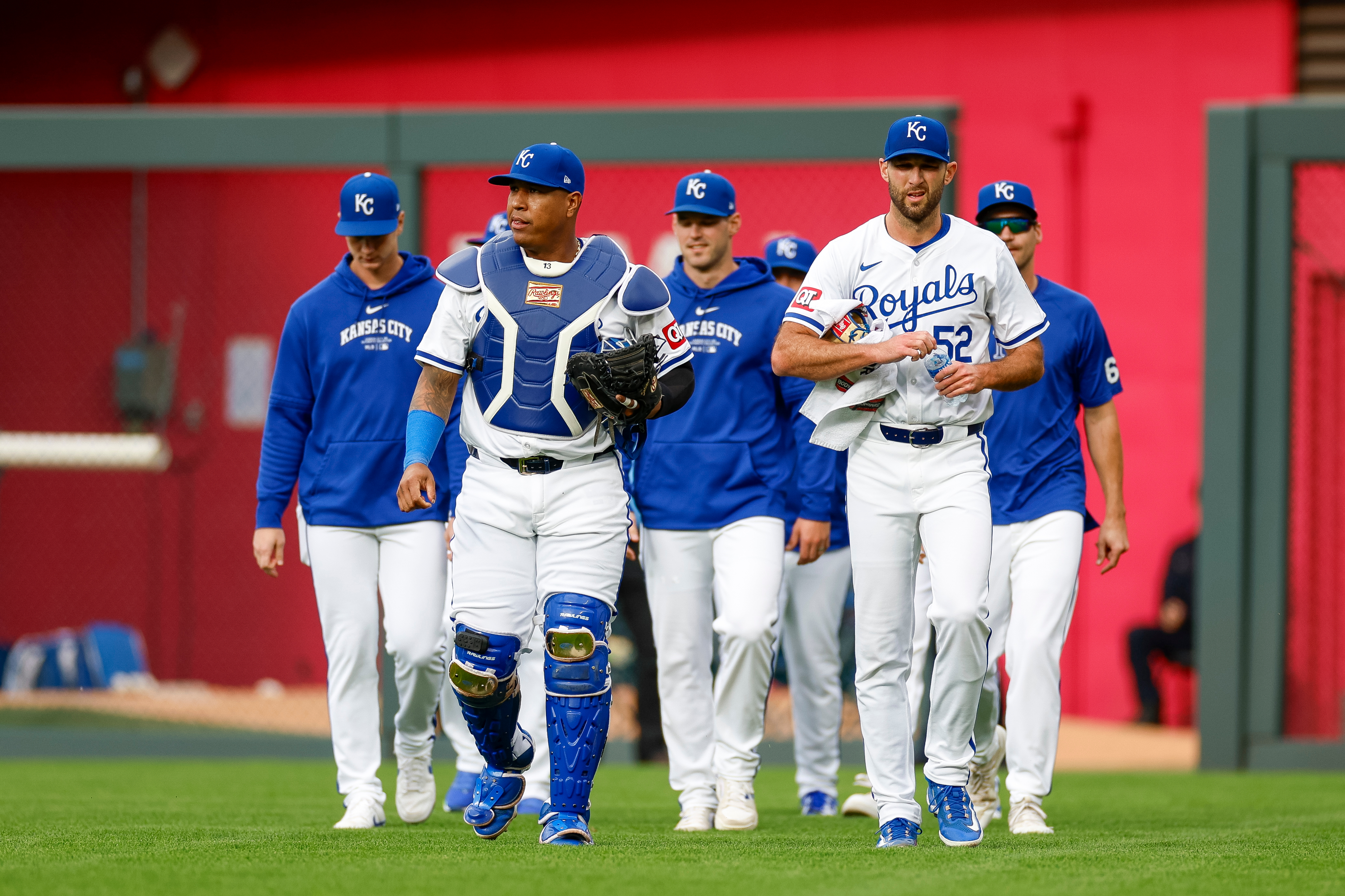 KANSAS CITY, MISSOURI - MAY 4: Michael Wacha #52 of the Kansas City Royals walks in from the bullpen with Salvador Perez #13 (2L) prior to a game against the Texas Rangers at Kauffman Stadium on May 4, 2024 in Kansas City, Missouri. (Photo by Brandon Sloter/Getty Images)