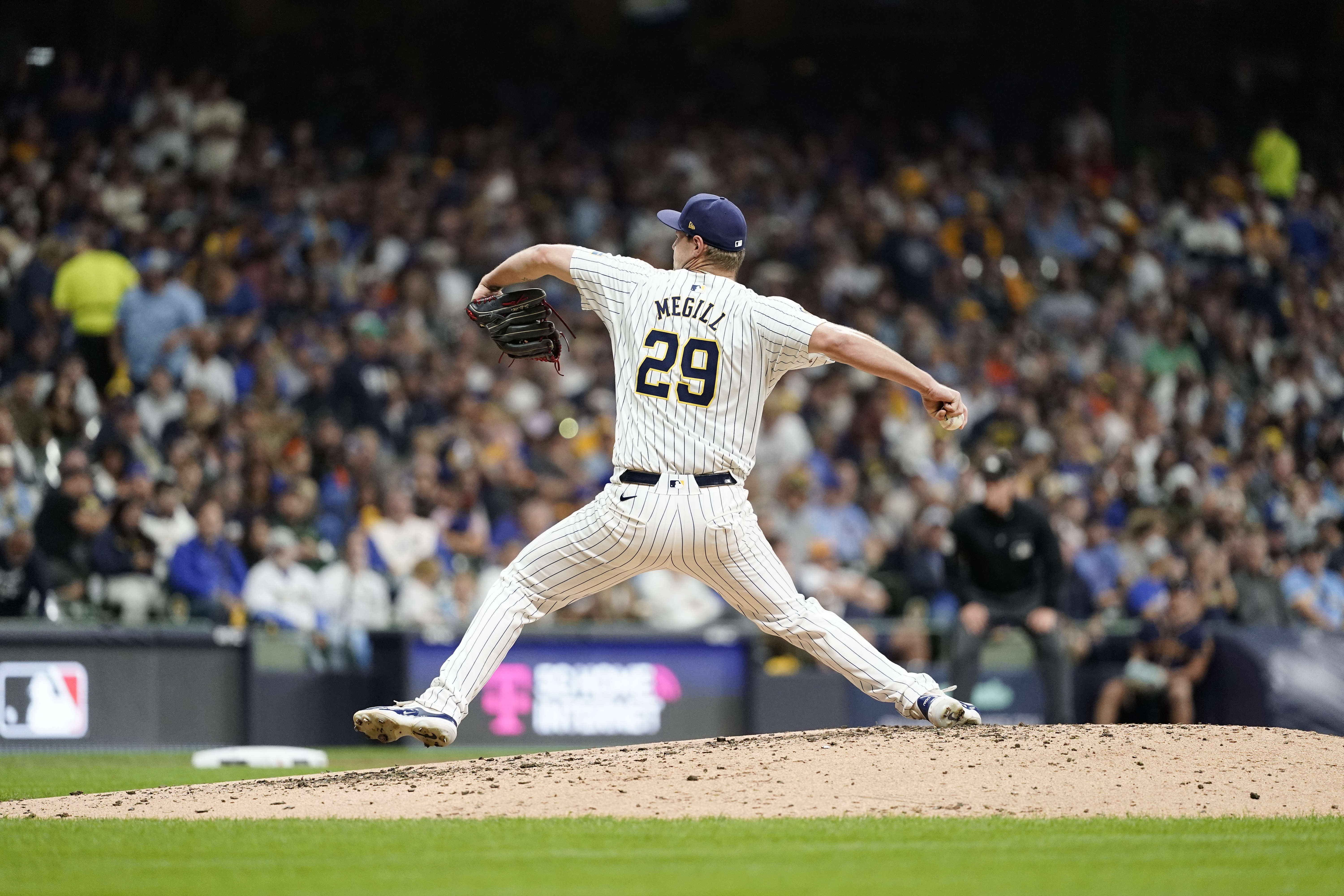 MILWAUKEE, WI - OCTOBER 03: Trevor Megill #29 of the Milwaukee Brewers pitches in the sixth inning during Game 3 of the Wild Card Series presented by T-Mobile 5G Home Internet between the New York Mets and the Milwaukee Brewers at American Family Field on Thursday, October 3, 2024 in Milwaukee, Wisconsin. (Photo by Aaron Gash/MLB Photos via Getty Images)