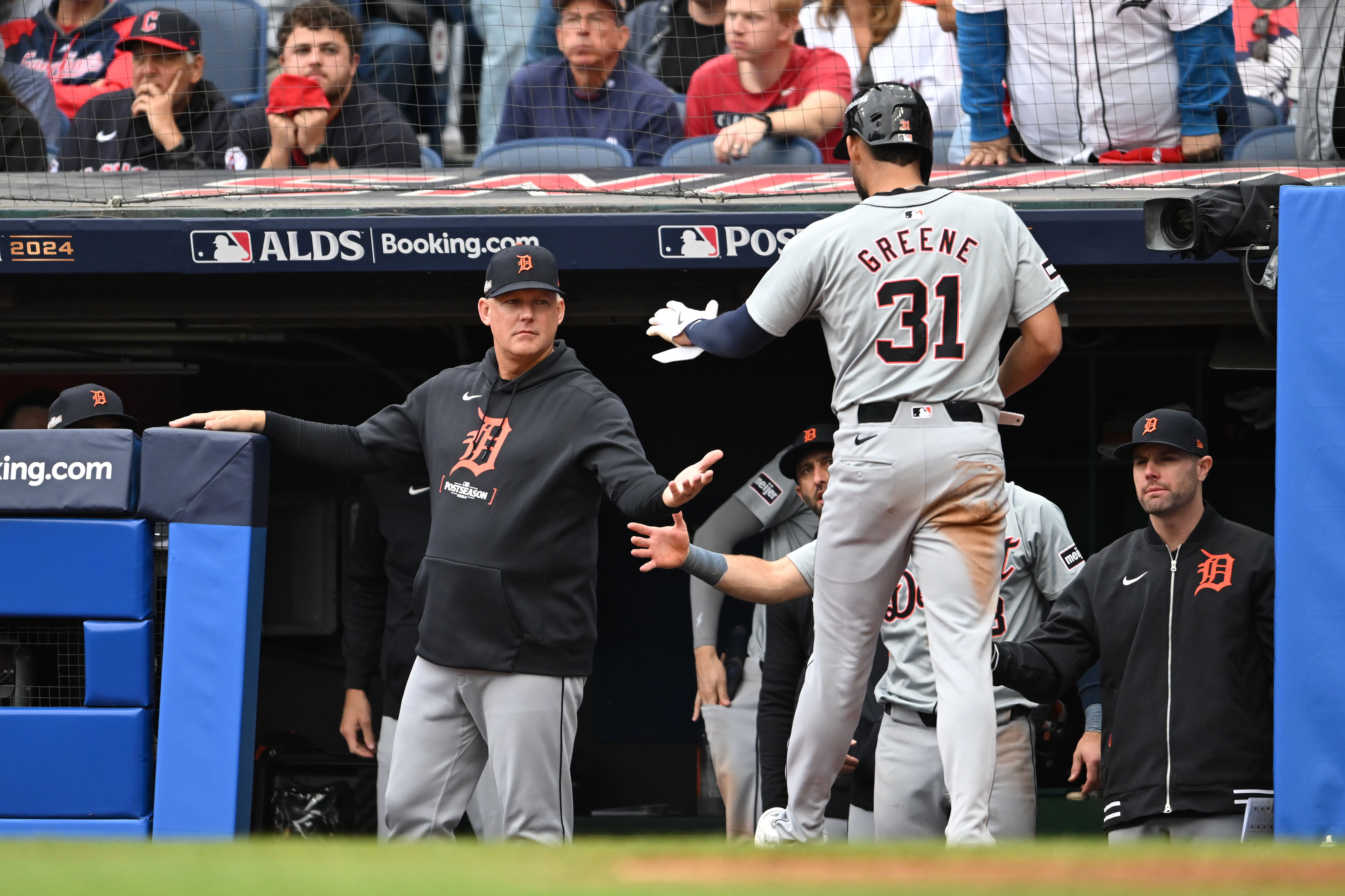 CLEVELAND, OHIO - OCTOBER 12: Manager A.J. Hinch #14 of the Detroit Tigers greets Riley Greene #31 of the Detroit Tigers during the seventh inning against the Cleveland Guardians during Game Five of the Division Series at Progressive Field on October 12, 2024 in Cleveland, Ohio. (Photo by Nick Cammett/Getty Images)