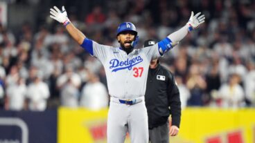 Teoscar Hernández of the Los Angeles Dodgers reacts after hitting a two-run double in the fifth inning during Game 5 of the 2024 World Series presented by Capital One between the Los Angeles Dodgers and the New York Yankees at Yankee Stadium.