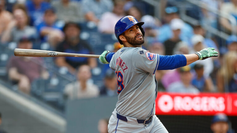 J.D. Martinez of the New York Mets swings the bat in the ninth inning during a game against the Toronto Blue Jays at Rogers Centre.
