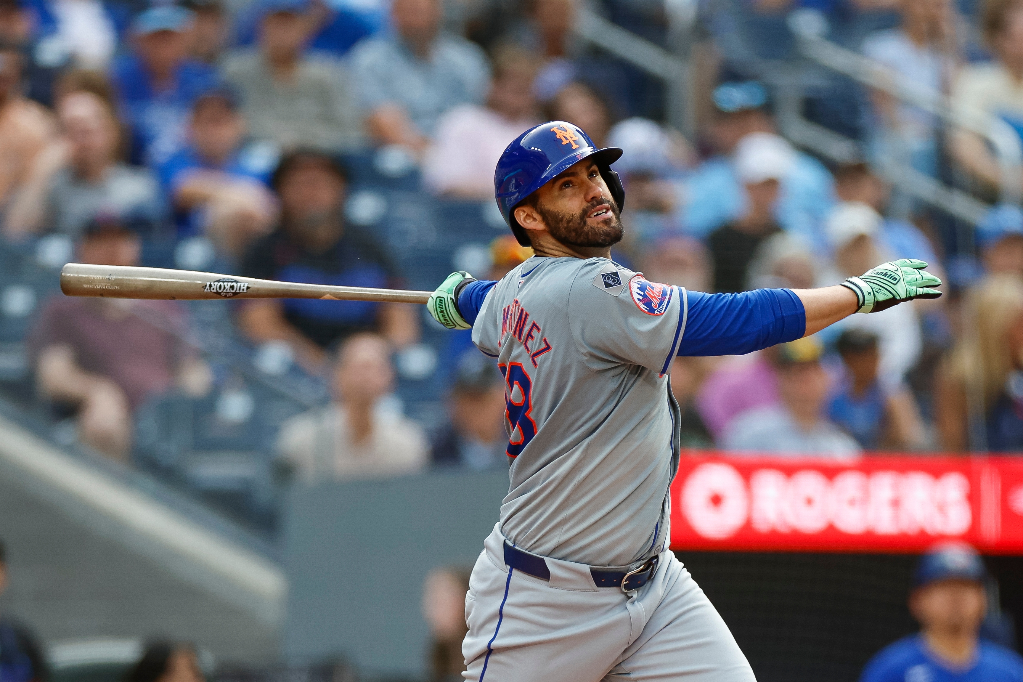 J.D. Martinez of the New York Mets swings the bat in the ninth inning during a game against the Toronto Blue Jays at Rogers Centre.