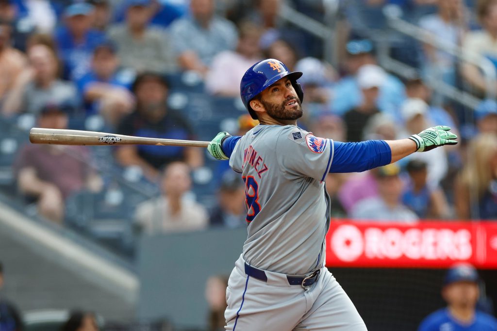 J.D. Martinez of the New York Mets swings the bat in the ninth inning during a game against the Toronto Blue Jays at Rogers Centre.