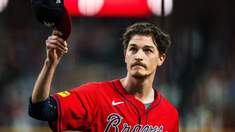 Max Fried of the Atlanta Braves waves to the crowd after coming out of the game during the ninth inning against the Kansas City Royals at Truist Park.