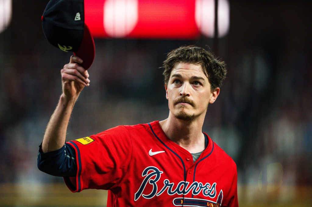 Max Fried of the Atlanta Braves waves to the crowd after coming out of the game during the ninth inning against the Kansas City Royals at Truist Park.