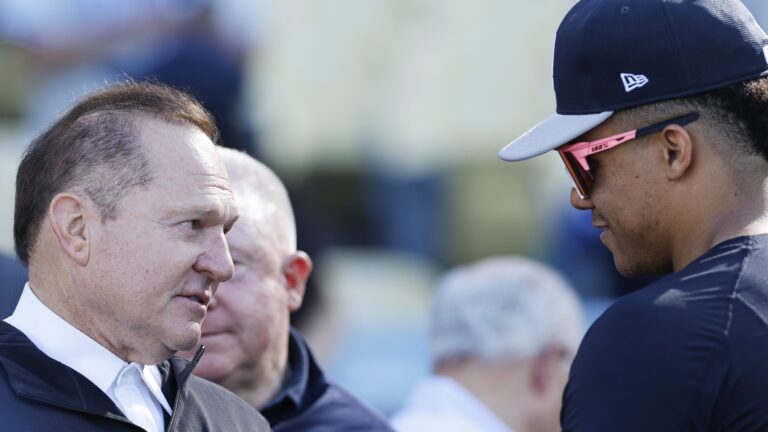 Sports agent Scott Boras talks to Juan Soto #22 of the New York Yankees during batting practice ahead of Game One of the 2024 World Series at Dodger Stadium.