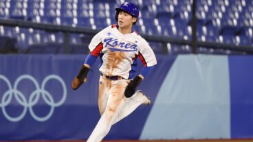 Hyeseong Kim of Team South Korea runs in to score their second run during the round one of baseball team competition match between Team Dominican Republic and Team South Korea on day nine of the Tokyo 2020 Olympic Games at Yokohama Baseball Stadium.