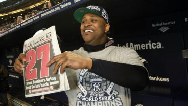 C.C. Sabathia of the New York Yankees celebrates in the dugout with a copy of the New York Post after their 7-3 win against the Philadelphia Phillies in Game Six of the 2009 MLB World Series at Yankee Stadium.