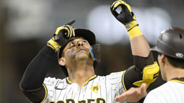 Donovan Solano of the San Diego Padres points skyward after hitting a single during the second inning of a baseball game against the Houston Astros at Petco Park.