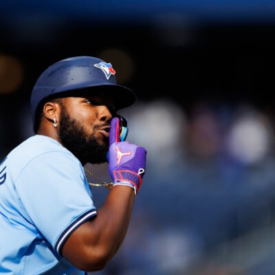 TORONTO, CANADA - AUGUST 24: Vladimir Guerrero Jr. #27 of the Toronto Blue Jays reacts as he rounds the bases after hitting a solo-home run in the eighth inning of their MLB game against the Los Angeles Angels at Rogers Centre on August 24, 2024 in Toronto, Ontario, Canada. (Photo by Cole Burston/Getty Images)