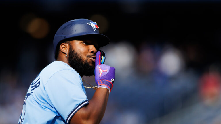 TORONTO, CANADA - AUGUST 24: Vladimir Guerrero Jr. #27 of the Toronto Blue Jays reacts as he rounds the bases after hitting a solo-home run in the eighth inning of their MLB game against the Los Angeles Angels at Rogers Centre on August 24, 2024 in Toronto, Ontario, Canada. (Photo by Cole Burston/Getty Images)
