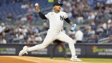 New York Yankees Pitcher Marcus Stroman delivers a pitch during the first inning of the Major League Baseball game between the Kansas City Royals and the New York Yankees.