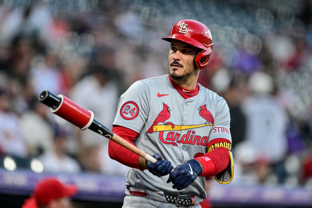 St. Louis Cardinals third baseman Nolan Arenado (28) warms up in the on deck circle in the first inning during a game between the St. Louis Cardinals and the Colorado Rockies at Coors Field.