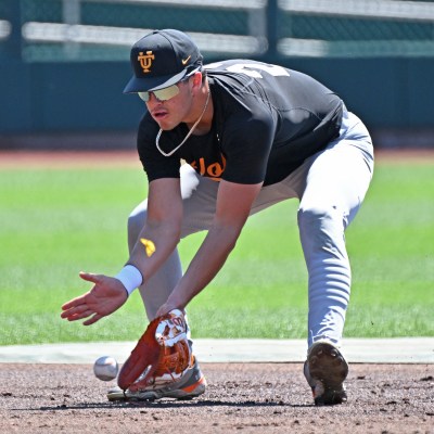 MLB Draft candidate Dean Curley of the Tennessee Volunteers fields a ground ball during pre-game warm-ups before playing the Texas A&M Aggies at the NCAA Division I Baseball Championship.