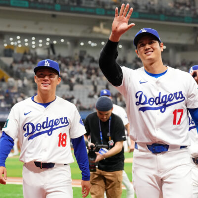 Yoshinobu Yamamoto and Shohei Ohtani of the Los Angeles Dodgers applaud fans prior to the exhibition game between Los Angeles Dodgers and Kiwoom Heroes at Gocheok Sky Dome.