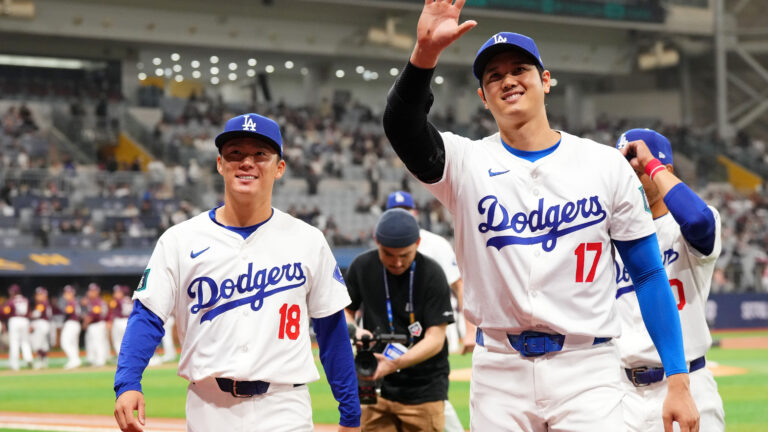 Yoshinobu Yamamoto and Shohei Ohtani of the Los Angeles Dodgers applaud fans prior to the exhibition game between Los Angeles Dodgers and Kiwoom Heroes at Gocheok Sky Dome.