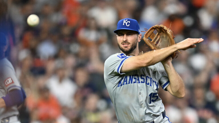 Paul DeJong of the Kansas City Royals throws to first base against the Houston Astros during the third inning at Minute Maid Park.