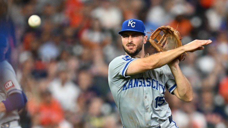 Paul DeJong of the Kansas City Royals throws to first base against the Houston Astros during the third inning at Minute Maid Park.