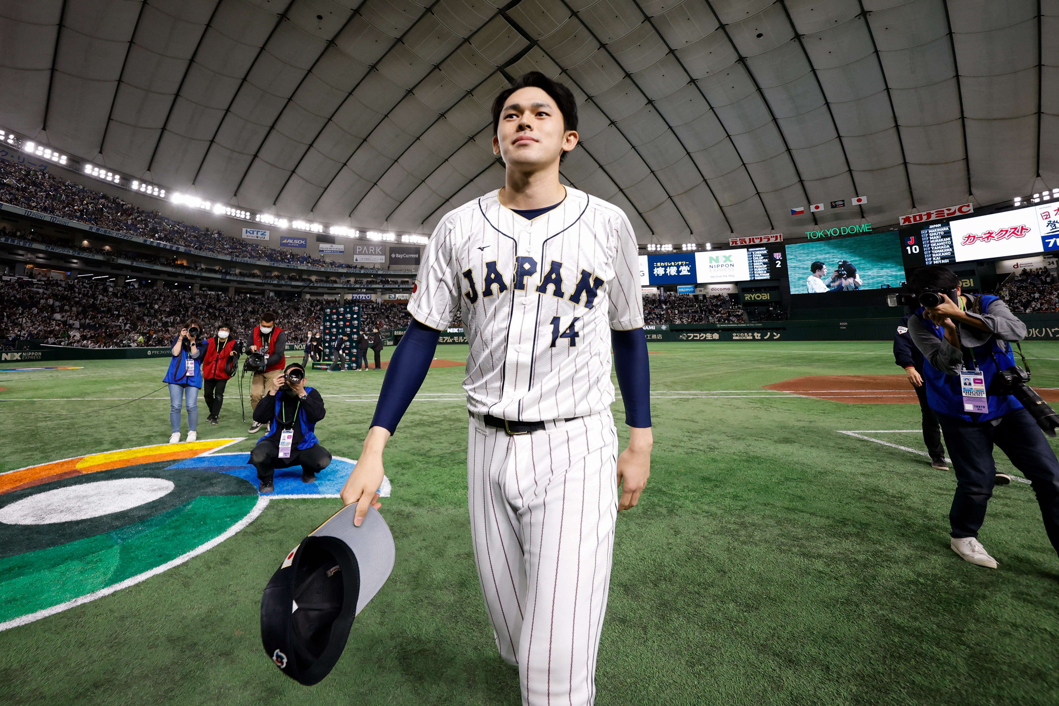 Roki Sasaki of Team Japan walks back to the locker room after their Game 6 of Pool B win over Team Czech Republic at Tokyo Dome.
