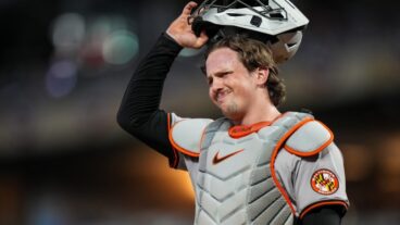 Adley Rutschman of the Baltimore Orioles looks on against the Minnesota Twins at Target Field.