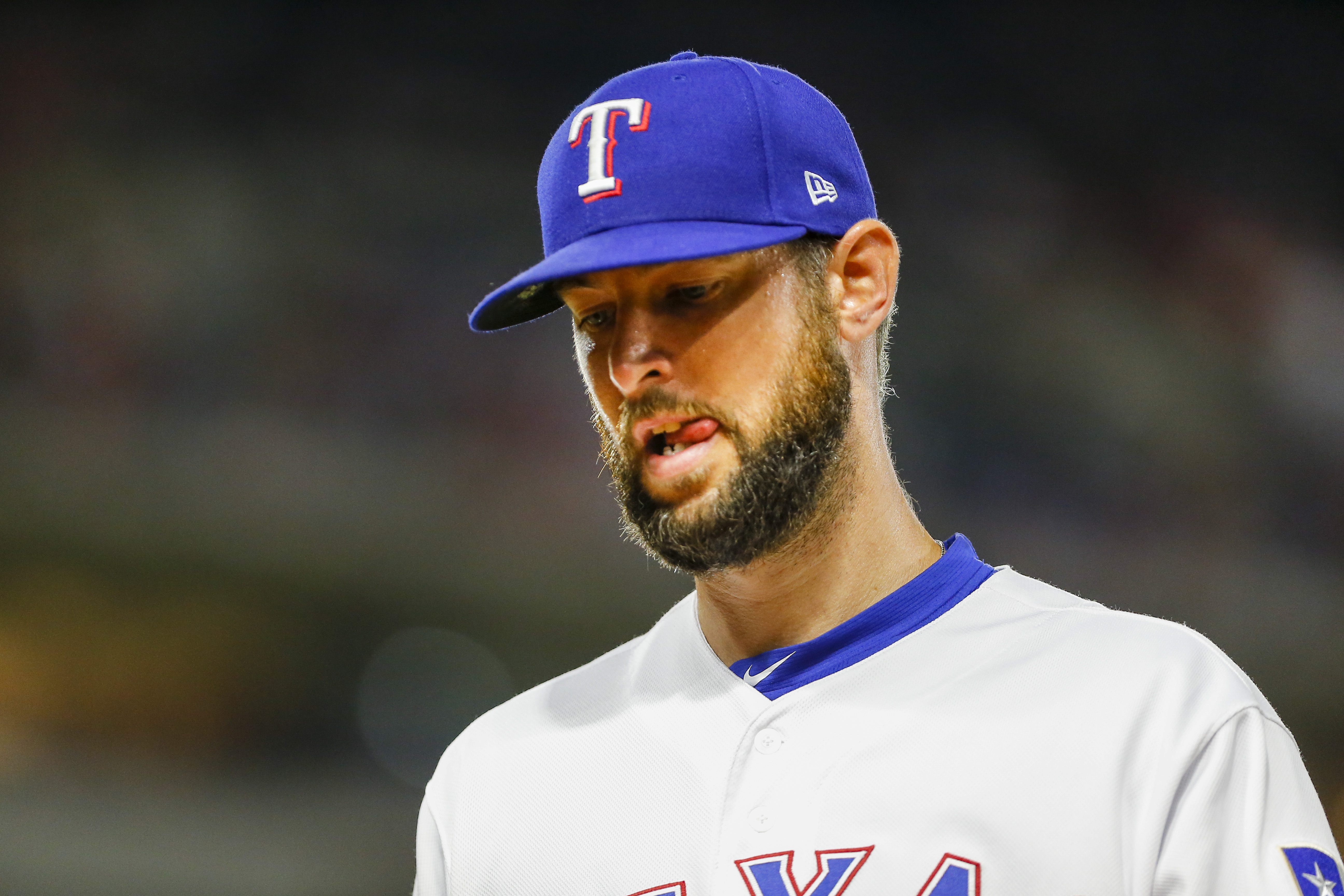 Texas Rangers relief pitcher Chris Martin walks back to the dugout during the game between the Texas Rangers and the Los Angeles Angels.