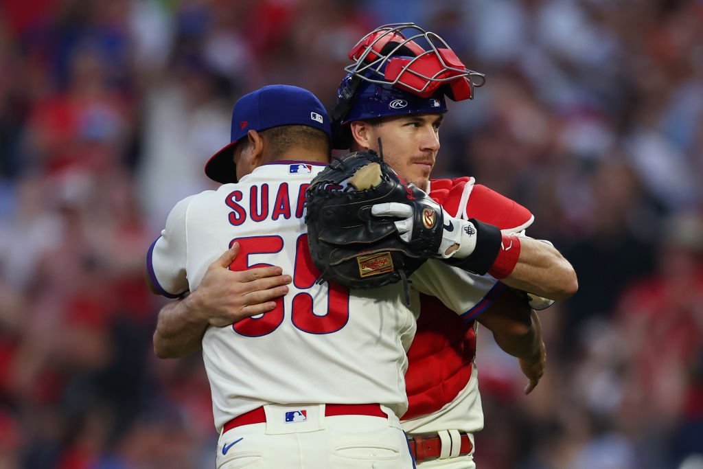PHILADELPHIA, PA - SEPTEMBER 25: Pitcher Ranger Suarez #55 of the Philadelphia Phillies is congratulated by catcher J.T. Realmuto #10 after pitching a complete game shutout as the Phillies defeated the Pittsburgh Pirates 3-0 at Citizens Bank Park on September 25, 2021 in Philadelphia, Pennsylvania. (Photo by Rich Schultz/Getty Images)