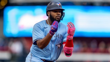 TORONTO, CANADA - AUGUST 19: Vladimir Guerrero Jr. #27 of the Toronto Blue Jays celebrates after hitting a home run against the Cincinnati Reds during the first inning in their MLB game at Rogers Centre on August 19, 2024 in Toronto, Canada. (Photo by Kevin Sousa/Getty Images)