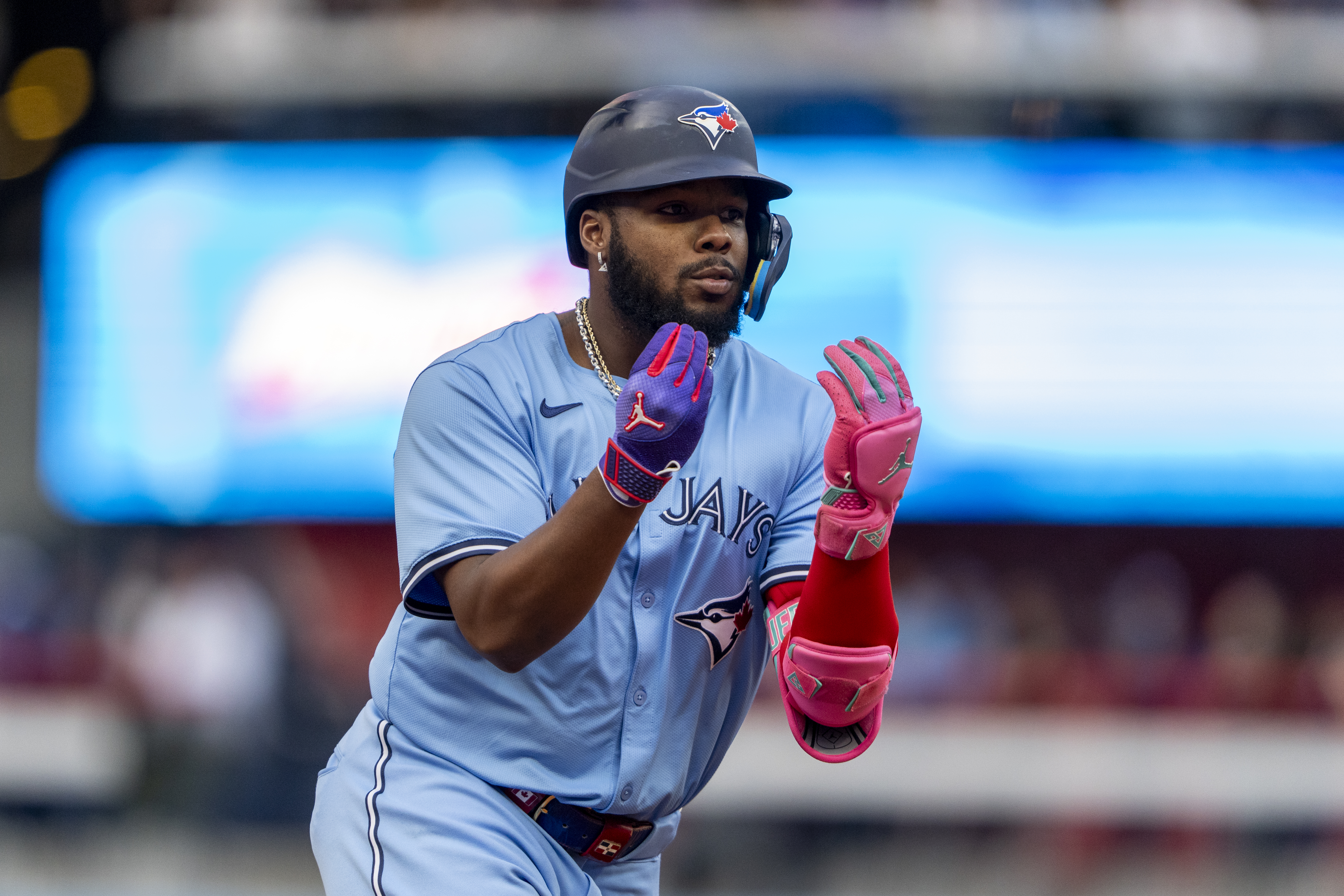 TORONTO, CANADA - AUGUST 19: Vladimir Guerrero Jr. #27 of the Toronto Blue Jays celebrates after hitting a home run against the Cincinnati Reds during the first inning in their MLB game at Rogers Centre on August 19, 2024 in Toronto, Canada. (Photo by Kevin Sousa/Getty Images)