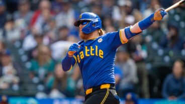 SEATTLE, WA - SEPTEMBER 15: Justin Turner #2 of the Seattle Mariners takes a swing during an at-bat in a game against the Texas Rangers at T-Mobile Park on September 15, 2024 in Seattle, Washington. Players are wearing #21 in honor of Roberto Clemente Day. (Photo by Stephen Brashear/Getty Images)