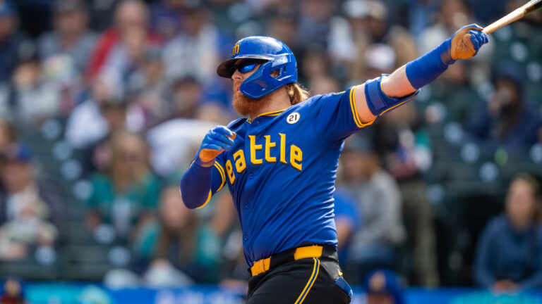 SEATTLE, WA - SEPTEMBER 15: Justin Turner #2 of the Seattle Mariners takes a swing during an at-bat in a game against the Texas Rangers at T-Mobile Park on September 15, 2024 in Seattle, Washington. Players are wearing #21 in honor of Roberto Clemente Day. (Photo by Stephen Brashear/Getty Images)