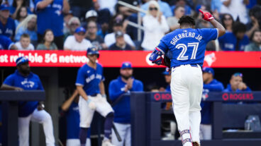 TORONTO, ON - SEPTEMBER 29: Vladimir Guerrero Jr. #27 of the Toronto Blue Jays salutes the crowd while coming out of the game after drawing a walk for his last at bat of the season, against the Miami Marlins, in their MLB game at the Rogers Centre on September 29, 2024 in Toronto, Ontario, Canada. (Photo by Mark Blinch/Getty Images)